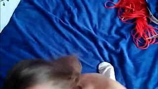 A great looking brunette babe in the garage with tattoos