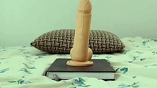 She says, 'I'm cumming on this big rubber cock on camera.'