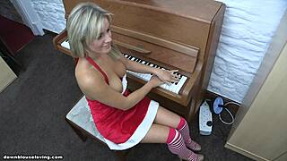 topless naughty blonde babe in christmas outfit playing piano with big natural tits 😏