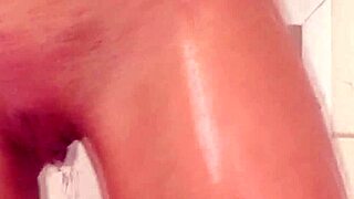 Adorable teen poses naked in shower, contrasting cute innocence with erotic allure