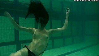 Brunette Teen Kristina Andreeva Swims Naked in Pool with Graceful Moves