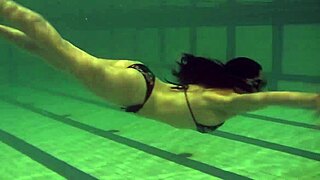 Brunette Teen Kristina Andreeva Swims Naked in Pool with Graceful Moves