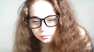 Teen with natural tits goes topless on webcam, playing with pussy and toys in public outdoor setting.