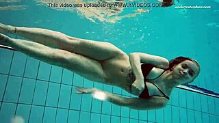 I am Dashka, a beautiful brunette stripping naked by the pool