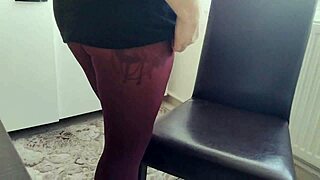 Teen striptease in pantyhose at window, playing with object