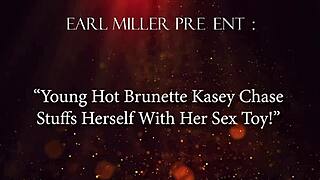 young hot brunette kasey chase in heels and dress stuffs herself to orgasm