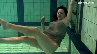 Katya Okuneva Bounces Playfully in a Dress by the Pool