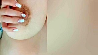 busty beauty teases big nipples on camera while parents sleep just behind