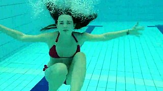 beautiful russian teen in red bikini with natural tits at the pool underwater