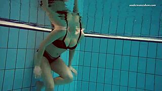 Czech Babe Vesta Strips and Dives Naked into Pool