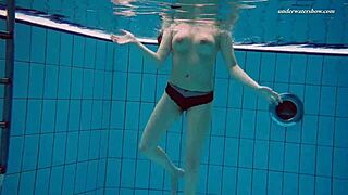 Underwater mermaid Vesta, a horny teen, teases in bikini by the pool