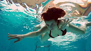 Underwater mermaid Vesta, a horny teen, teases in bikini by the pool