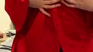 I love watching this brunette in red lingerie tease her big tits and ass