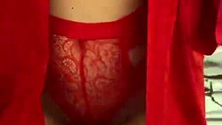 I love watching this brunette in red lingerie tease her big tits and ass