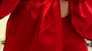 I love watching this brunette in red lingerie tease her big tits and ass