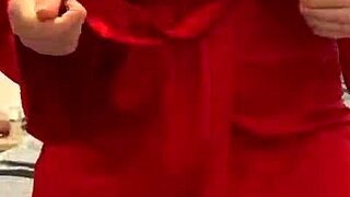 I love watching this brunette in red lingerie tease her big tits and ass