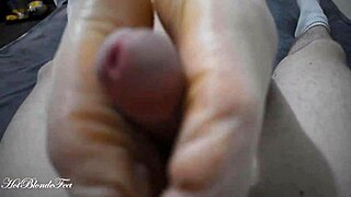 Miley Grey gives the sexiest footjob with her legs and tits