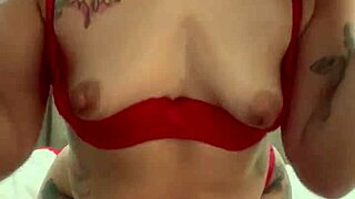 Alina Modelista teases in red lingerie with oil on camera