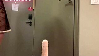 The college girl in a short skirt actively moves her ass on a huge dildo