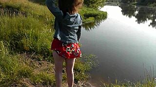 Brunette babe Assol teases wild beach bare