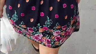 street whore shows her upskirt in the city