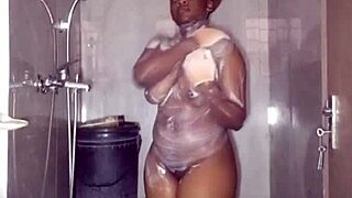 naughty african student nurse bares plump perky tits bucket bathing bts
