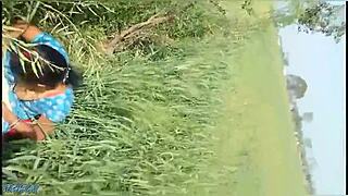 Desi bhabhi fingers wet pussy then gets fucked in fields